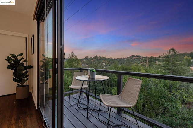 view of balcony at dusk