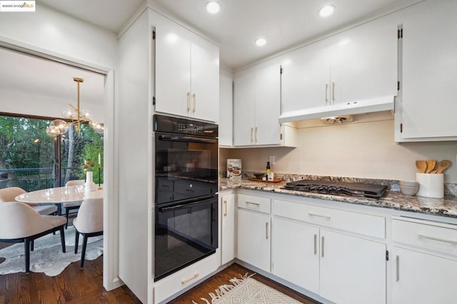 kitchen featuring white cabinets, dark hardwood / wood-style flooring, and black appliances