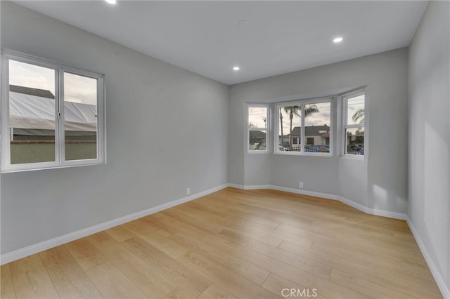 spare room featuring light hardwood / wood-style flooring