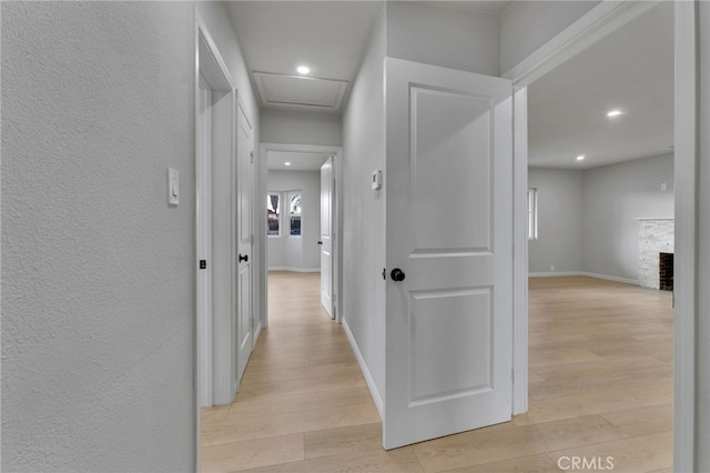 corridor featuring light hardwood / wood-style floors