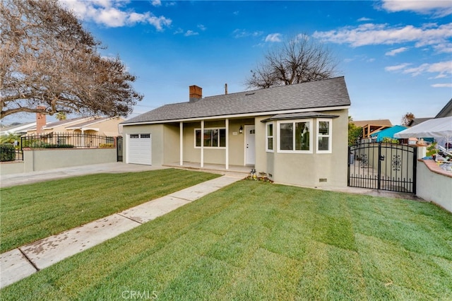 view of front of house featuring a garage and a front lawn