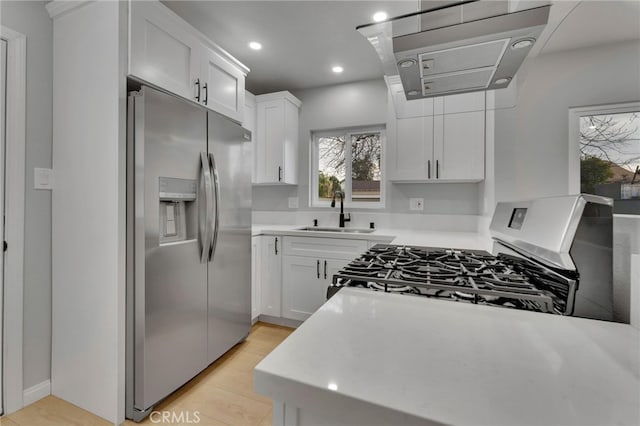 kitchen featuring white cabinetry, sink, and appliances with stainless steel finishes