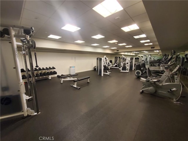 exercise room with a drop ceiling