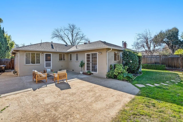 back of house featuring a yard, outdoor lounge area, and a patio