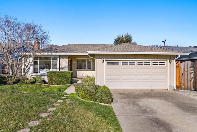 single story home featuring a garage and a front yard