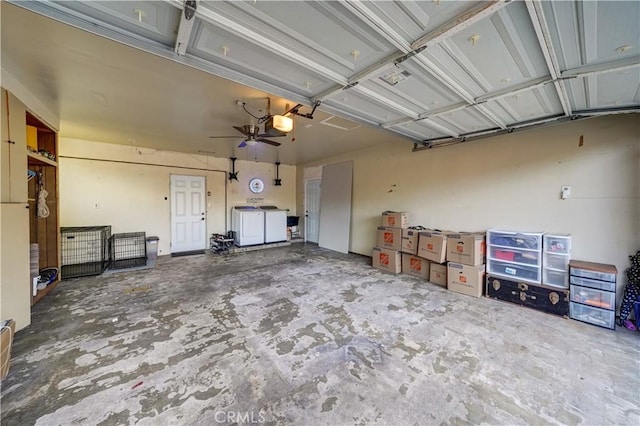 garage featuring a garage door opener and washing machine and clothes dryer