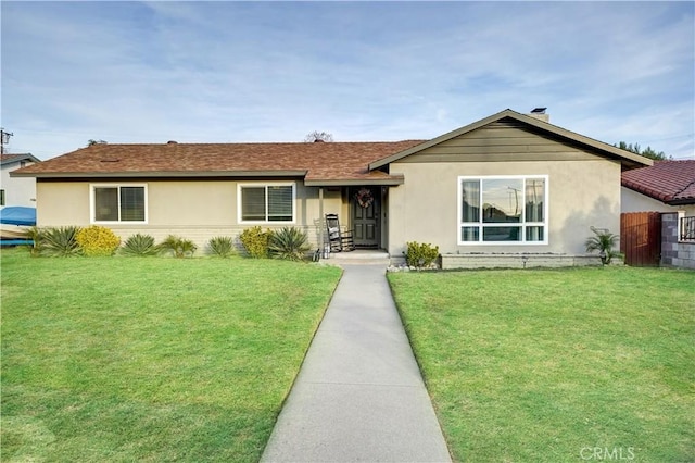 ranch-style home with a front yard