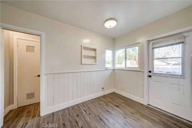 doorway to outside featuring wood-type flooring