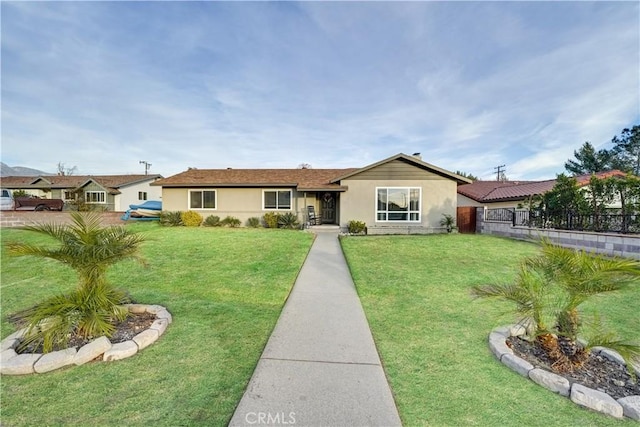 ranch-style home featuring a front lawn