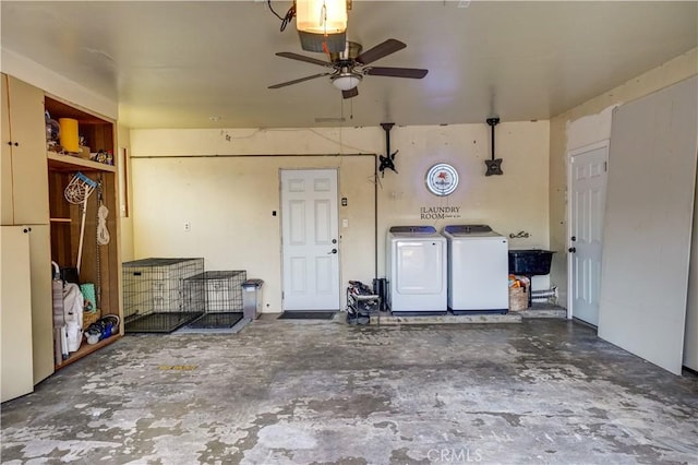 garage with ceiling fan, a garage door opener, sink, and washer and dryer