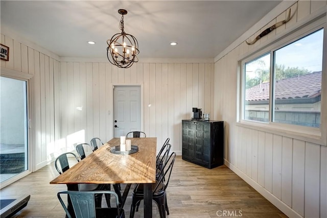 dining room featuring a chandelier and light wood-type flooring