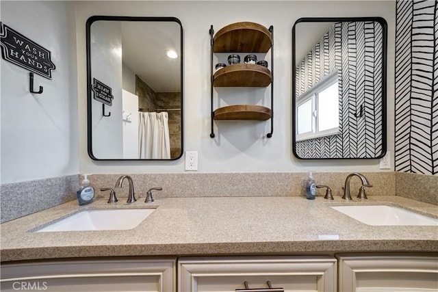 bathroom featuring vanity and a shower with shower curtain