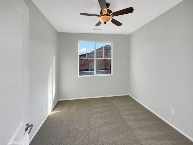 empty room featuring carpet and ceiling fan