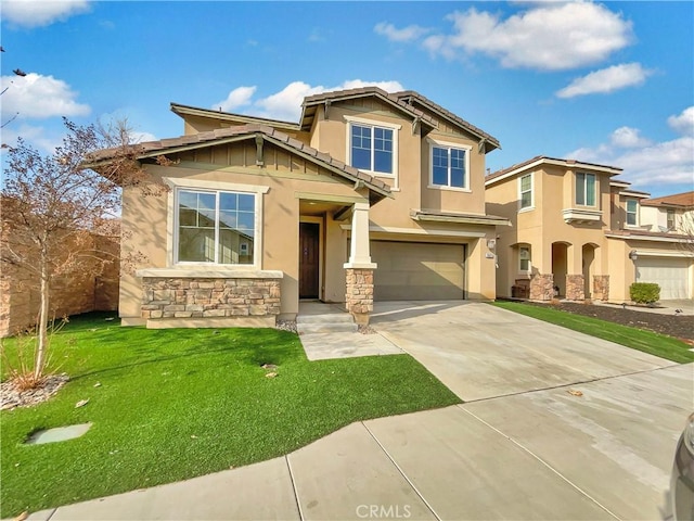 craftsman house with a garage and a front lawn