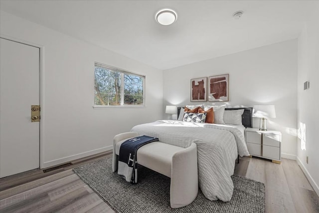 bedroom with light hardwood / wood-style floors