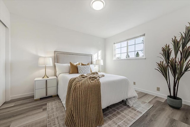 bedroom with hardwood / wood-style floors