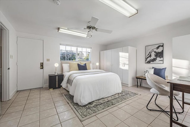 tiled bedroom with ceiling fan