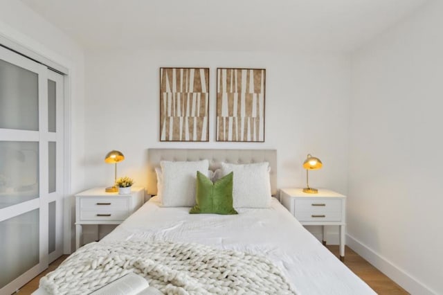 bedroom with hardwood / wood-style floors