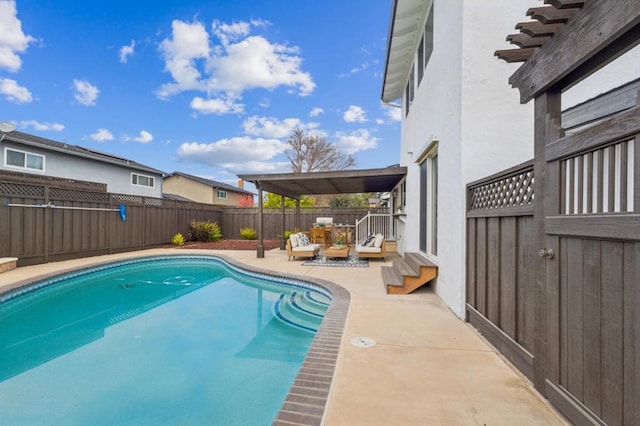 view of swimming pool with a patio area