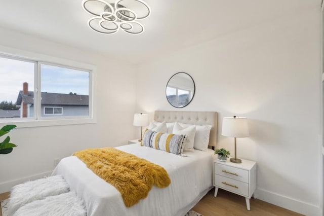 bedroom with light hardwood / wood-style floors