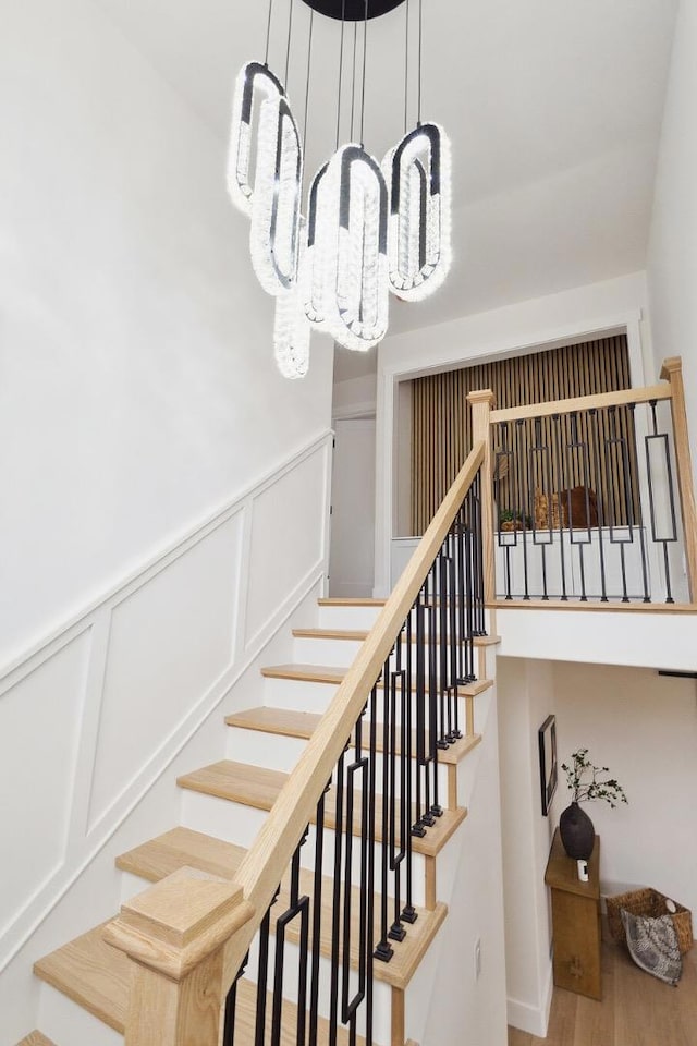 stairs featuring wood-type flooring