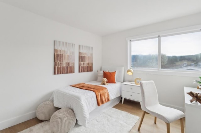 bedroom featuring light wood-type flooring