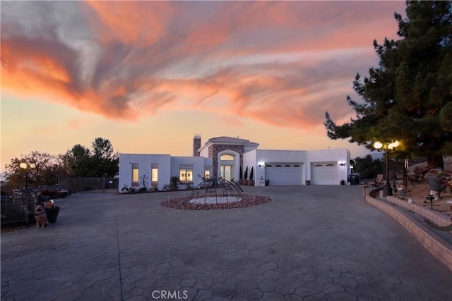 view of front of property with a garage