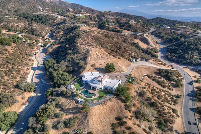 birds eye view of property featuring a mountain view