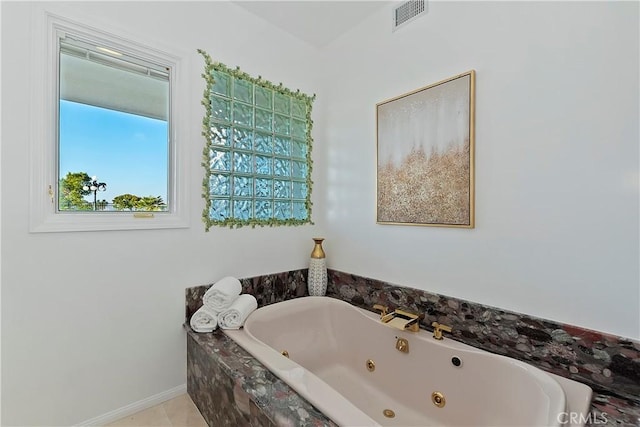 bathroom with a relaxing tiled tub