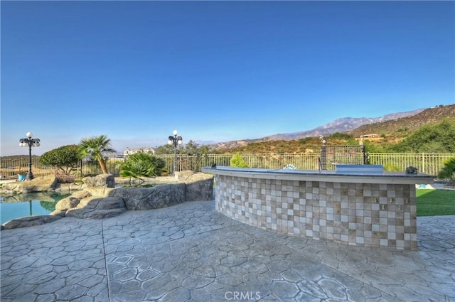 exterior space featuring a bar and a mountain view