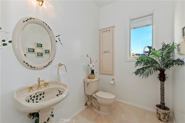 bathroom featuring sink and toilet