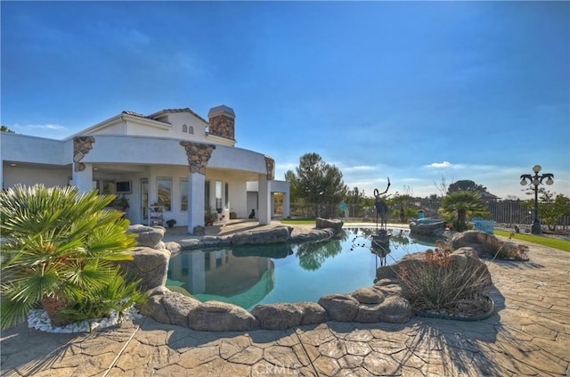 view of pool featuring a patio