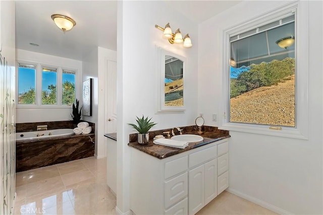 bathroom featuring vanity, a bath, and tile patterned floors