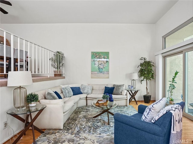 living room with hardwood / wood-style floors and ceiling fan