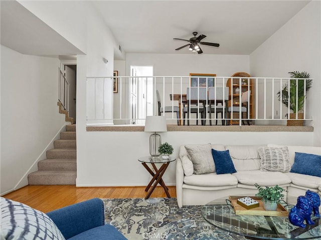 living room with ceiling fan and hardwood / wood-style floors