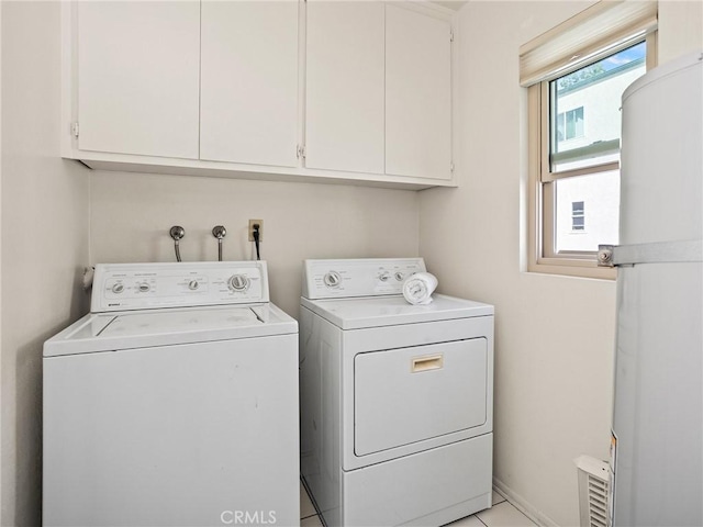 washroom with cabinets and separate washer and dryer