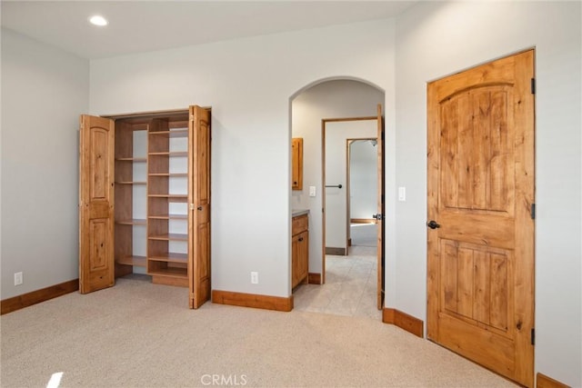 unfurnished bedroom with light carpet