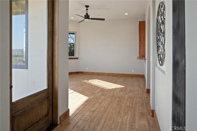 entryway with ceiling fan and light wood-type flooring