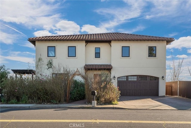 mediterranean / spanish-style house featuring a garage