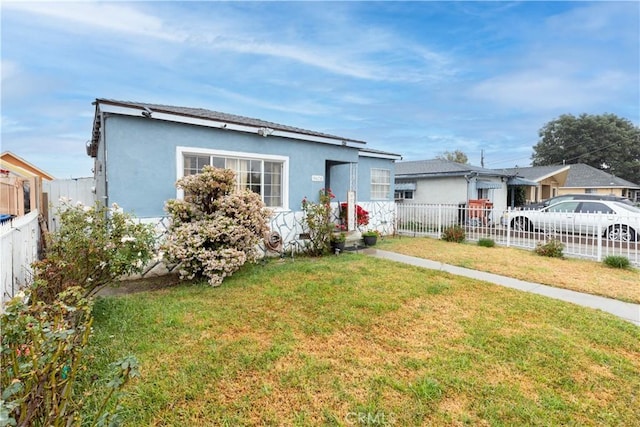 view of front of home with a front yard