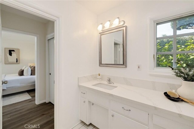 bathroom with vanity and wood-type flooring