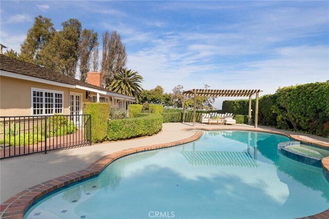 view of pool with a patio area and a pergola