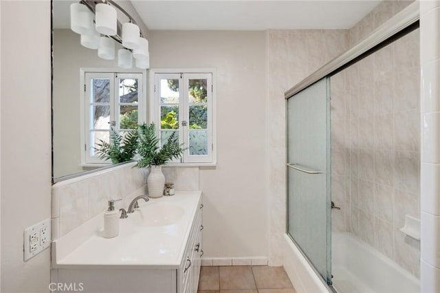 bathroom featuring vanity, tile patterned floors, and shower / bath combination with glass door