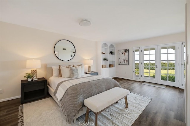 bedroom with dark wood-type flooring, access to exterior, and french doors