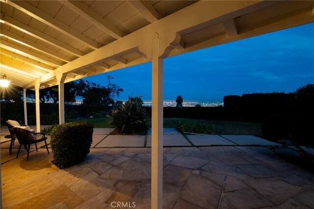 view of patio terrace at dusk