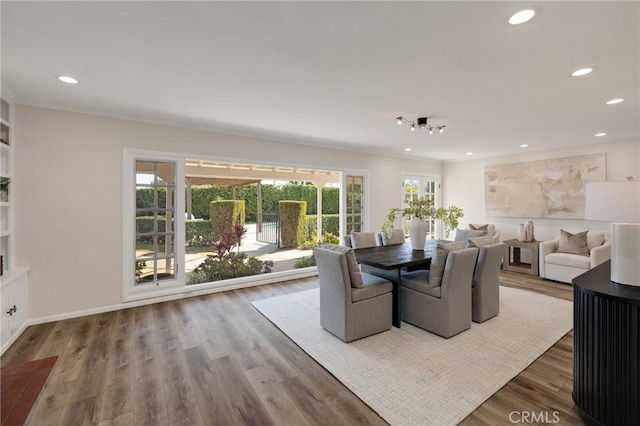 dining room with hardwood / wood-style flooring