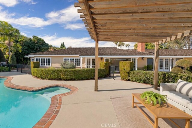 view of swimming pool with a patio, an outdoor hangout area, and a pergola