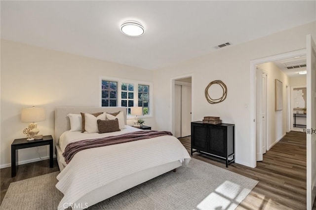 bedroom featuring dark hardwood / wood-style flooring