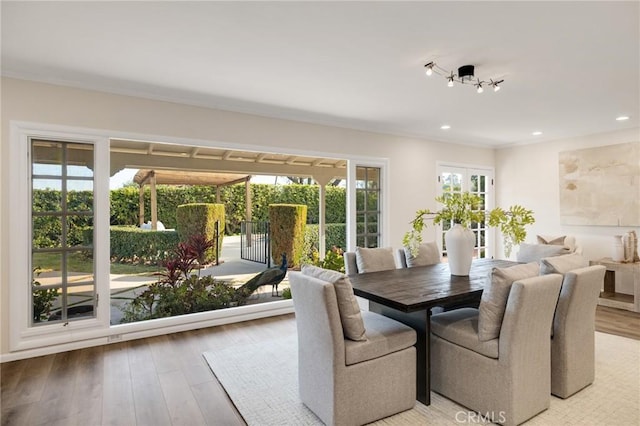 dining space with light wood-type flooring