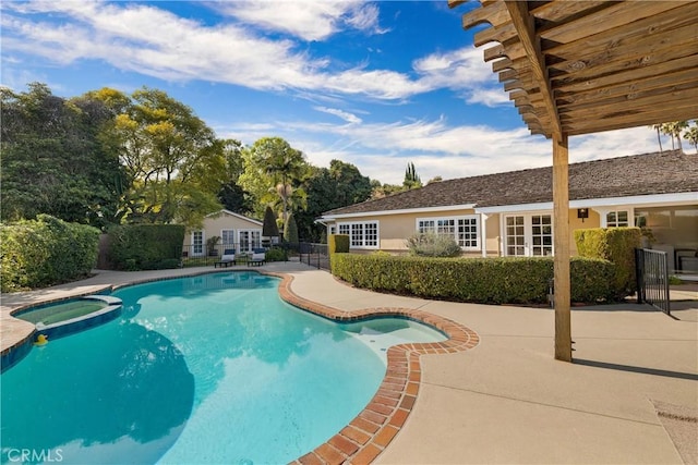 view of pool featuring an in ground hot tub and a patio